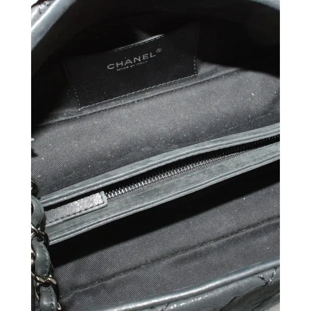 CHANEL Just Mademoiselle Mini Bowler Bag in Iridescent Black Leather